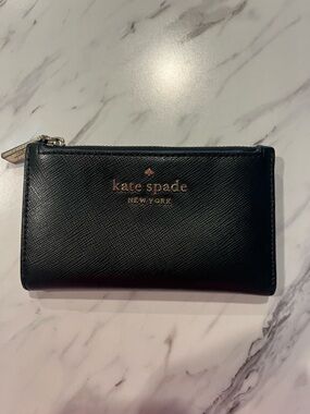 kate spade black saffiano zip-around wallet with gold logo